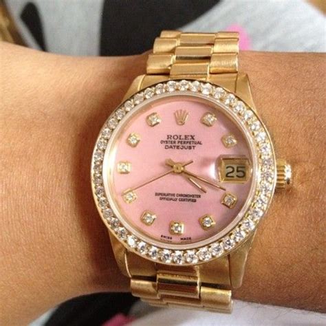 gold rolex watch with pink face